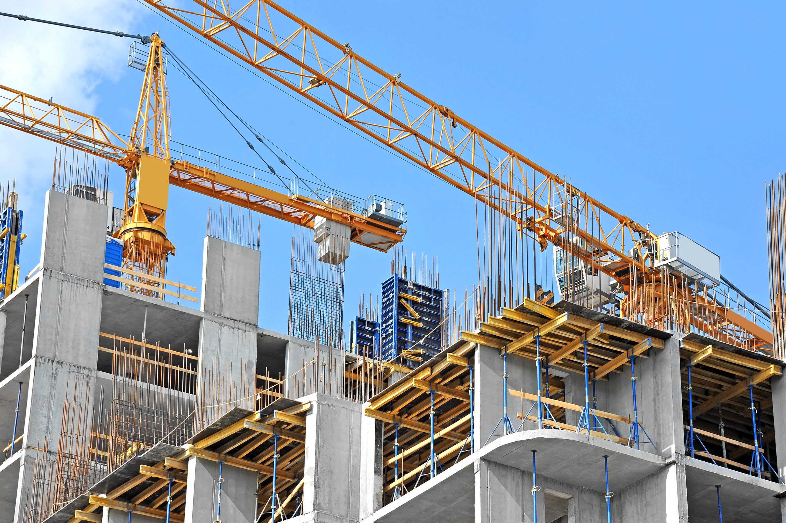 Tower cranes over concrete formwork on a building site